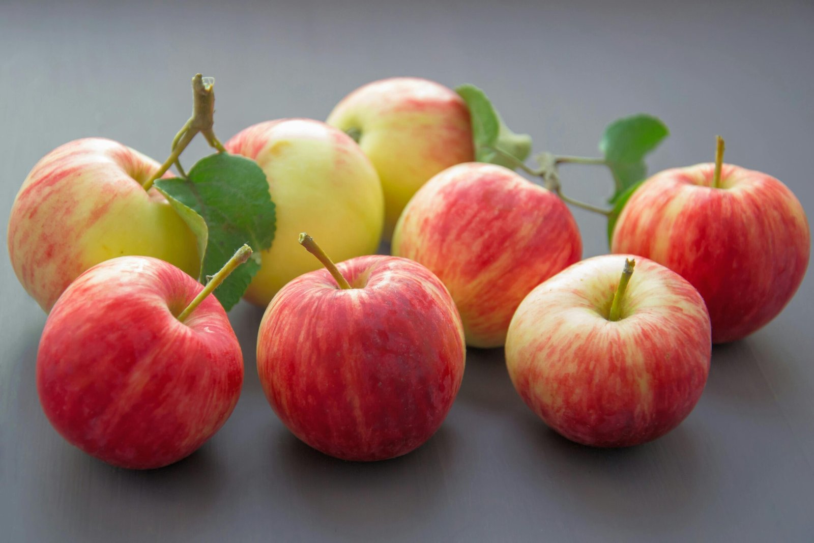 Vibrant red and yellow apples showcasing freshness and harvest's bounty.